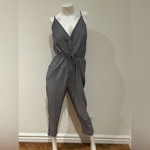 One piece jumpsuit. Black and white pinstrip.  Adjustable straps.